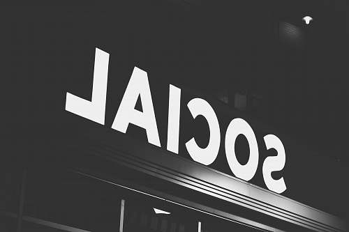 word white Social signage at nighttime alphabet