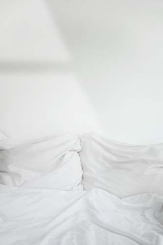 grey white textile cushion
