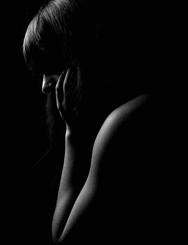 skin woman holding her cheek back