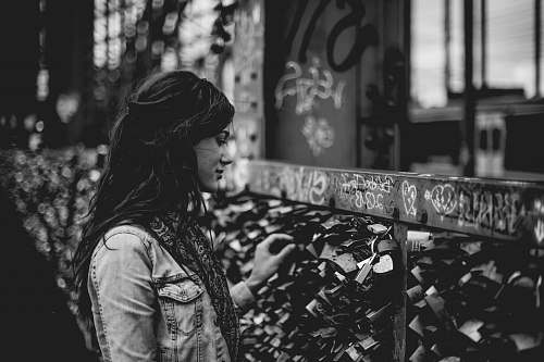 love woman holding padlock on bridge human