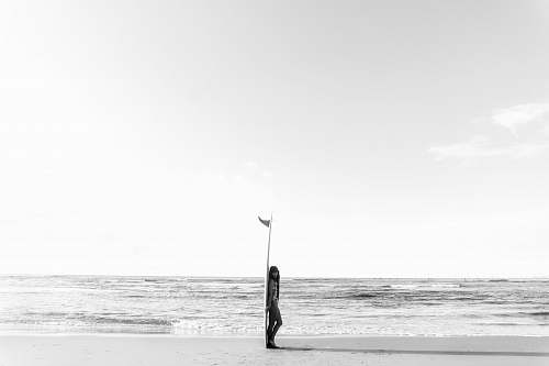 ocean woman leaning on surfboard outdoors