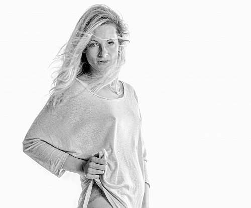apparel woman lifting her shirt with her left hand clothing