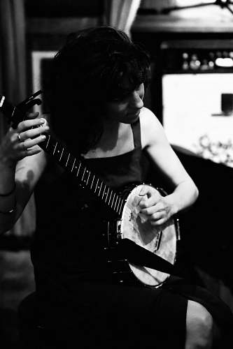 guitar woman playing banjo guitarist