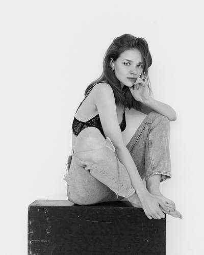 clothing woman sitting on black box apparel