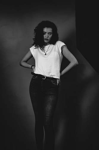 human woman standing near white wall person