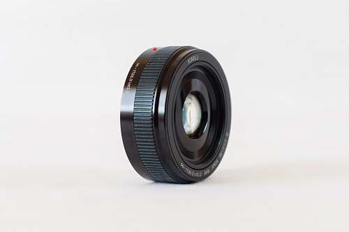 lumix black camera lens on white surface lense