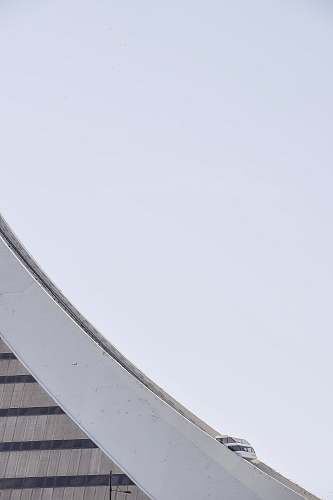 minimal A cable car on a concrete structure with a curving slope cable car