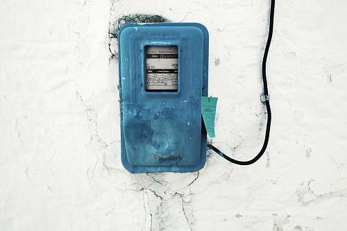 cable blue corded electronic appliance mounted on white painted wall electricty