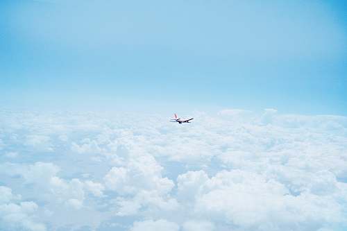 clouds flying airplane above clouds flight