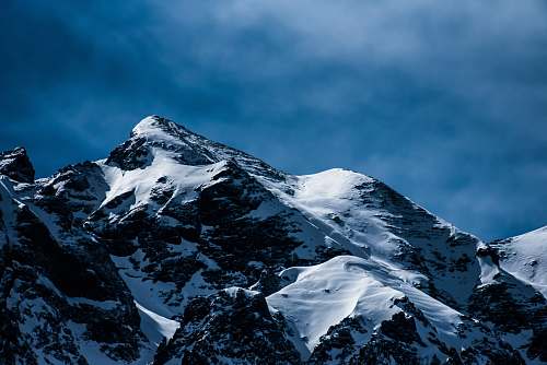 mountain mountain covered by snow snow