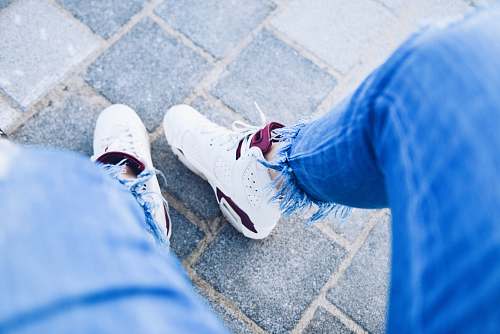 shoe person wearing pair of white Air Jordan 6's sneakers