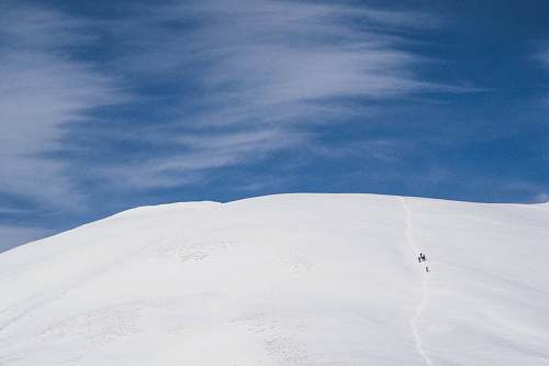 hike two person on white snow mountain summit