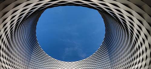 circle worm's eye view of blue sky achitecture