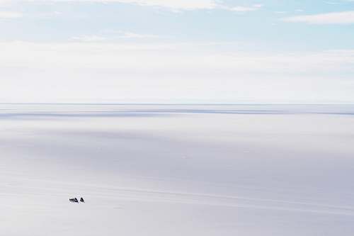 horizon body of water under blue sky sky