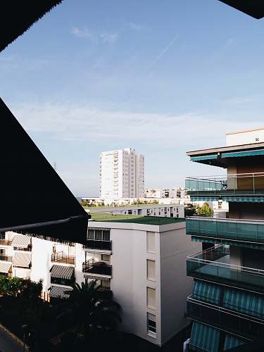 city aerial photography of multi-story buildings during daytime high rise