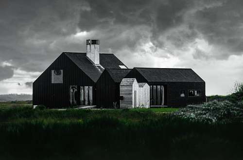 cloud black and white house beside green grass field rural