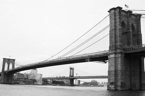 black-and-white Brooklyn Bridge in New York City bridge