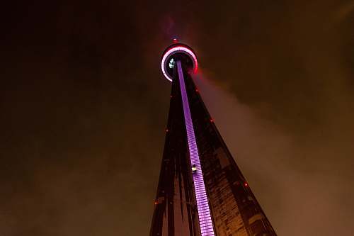 architecture low angle photo of tower at night hanlan's point ferry dock