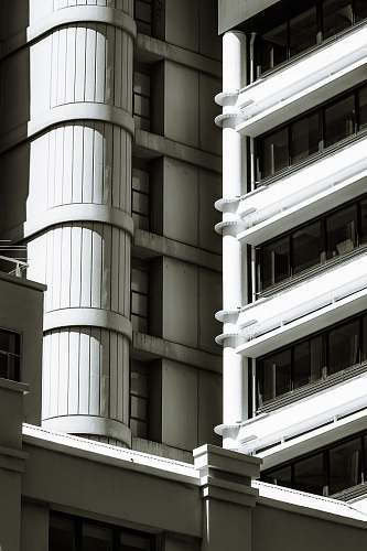 window low-angle photography of concrete building during daytime office building
