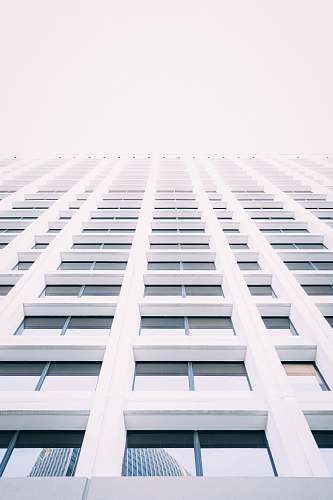 city low-angle photography of white concrete building urban