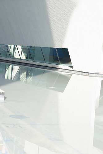 grey mirrors reflected on white polished floor architecture