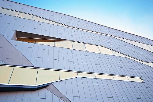 windows Modern building design with distinctive unique shaped glass windows city