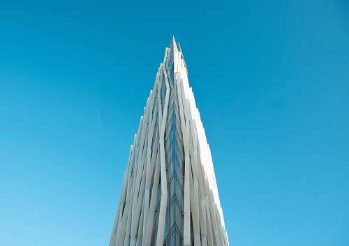 tower photography of white building under clear blue sky architecture