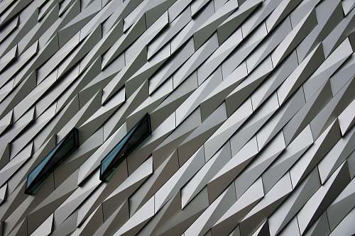 grey Undulating abstract shapes on a building facade at The Titanic Memorial Garden. pattern