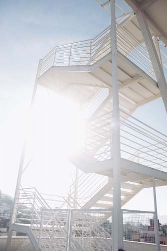 banister vacant white stairs during daytime handrail