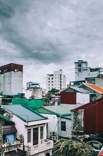 hanoi white and gray concrete mid-rise buildings under gray clouds vietnam