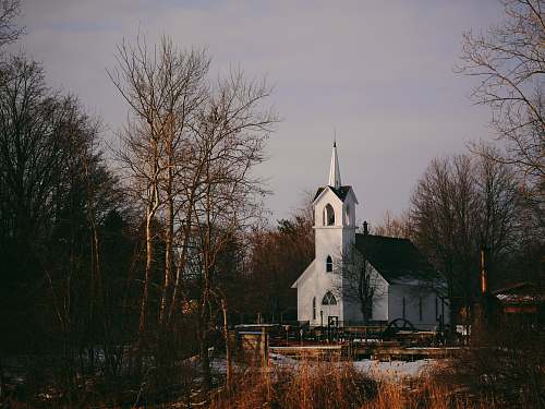 church white church near trees at daytime worship