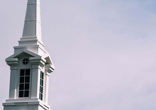 architecture white concrete building at daytime spire