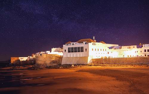 asilah white concrete structure during nighttime morocco