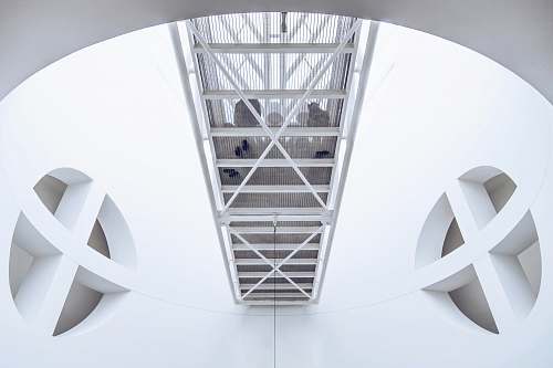 architecture worm's eye photography of white concrete building star symbol