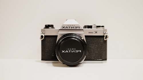 electronics round black and silver analog watch vintage pentax film camera