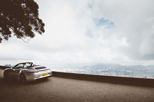 automobile gray coupe during daytime transportation