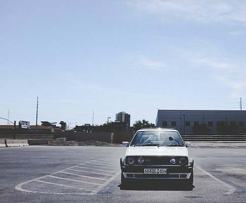 vehicle parked white car during daytime transportation