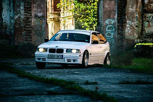 automobile white vehicle on road at daytime transportation