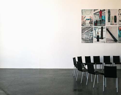 furniture black chairs beside wall tabletop