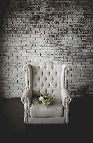 furniture white flowers on top of white armchair grey