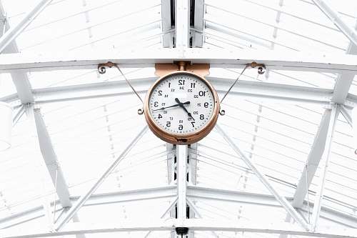 montreal round gold and white analog clock reading at 7:10 canada
