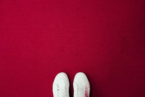 shoe pair of white lace-up shoes red