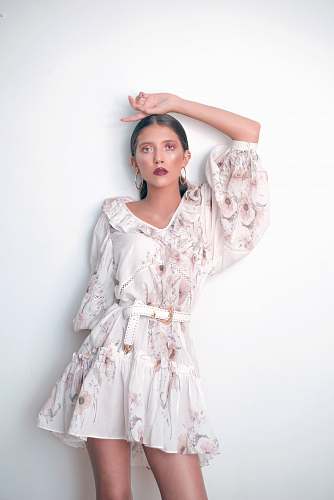 apparel woman wearing white V-neck long-sleeved dress fashion