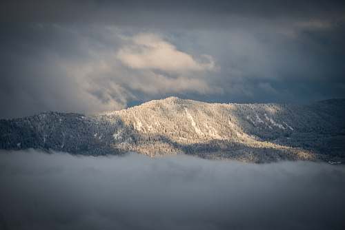 clouds mountain view under cloudy sky during daytime france