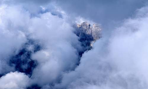 nature rock formation covered with clouds weather