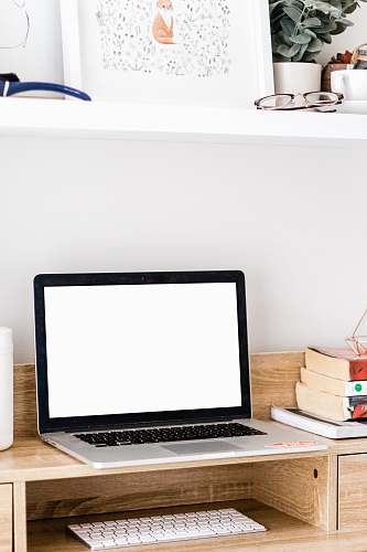 pc MacBook Pro on brown wooden table electronics