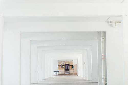 white cabinet and table inside white concrete building building