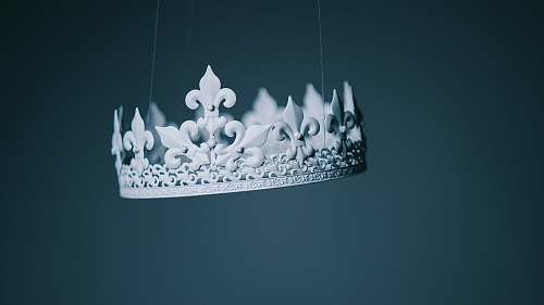 white shallow focus photography white crown hanging decor hanging