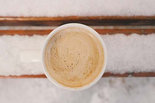 coffee cup of cream frothed coffee winter