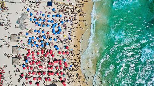 colorful aerial view of people at the beach drone view